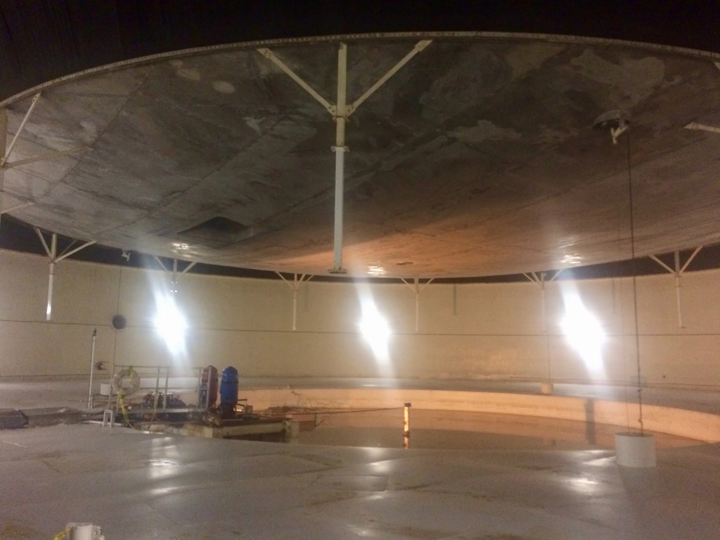 The Biosphere 2 lung chamber with its immense aluminum pressure cap suspended overhead.